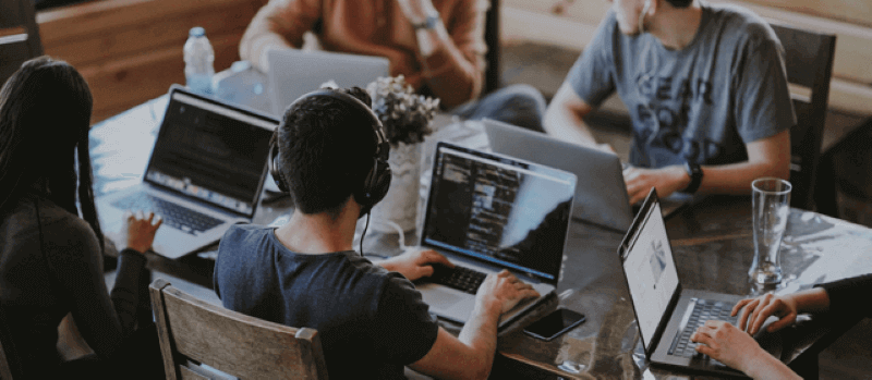 team of developers sitting at a desk